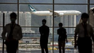 A Cathay Pacific aircraft comes in to land at Hong Kong International Airport on Aug 11, 2021. (ISAAC LAWRENCE / AFP)
