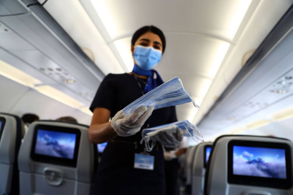 Wearing of masks inside flights no longer mandatory in India Asia