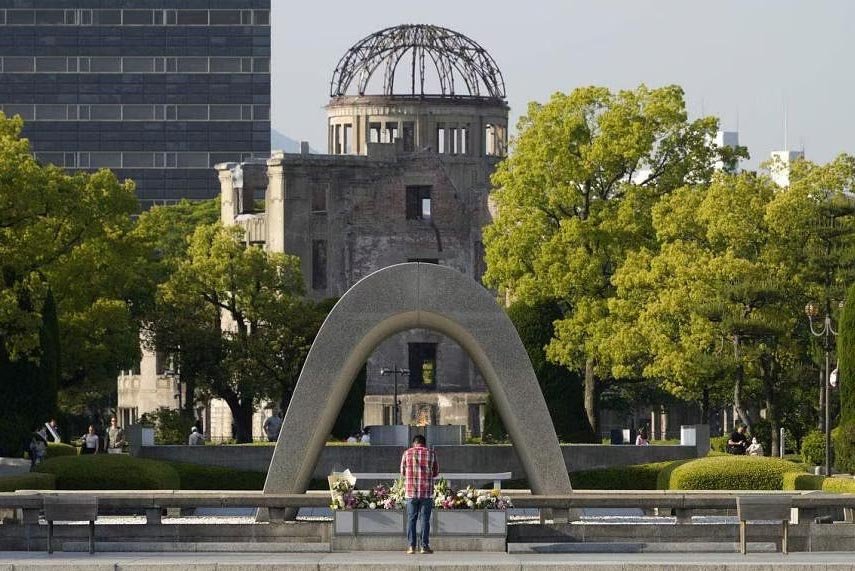 A man offering prayers in front of a cenotaph in the Hiroshima Peace Memorial Park on May 17, 2023. PHOTO: EPA-EFE
