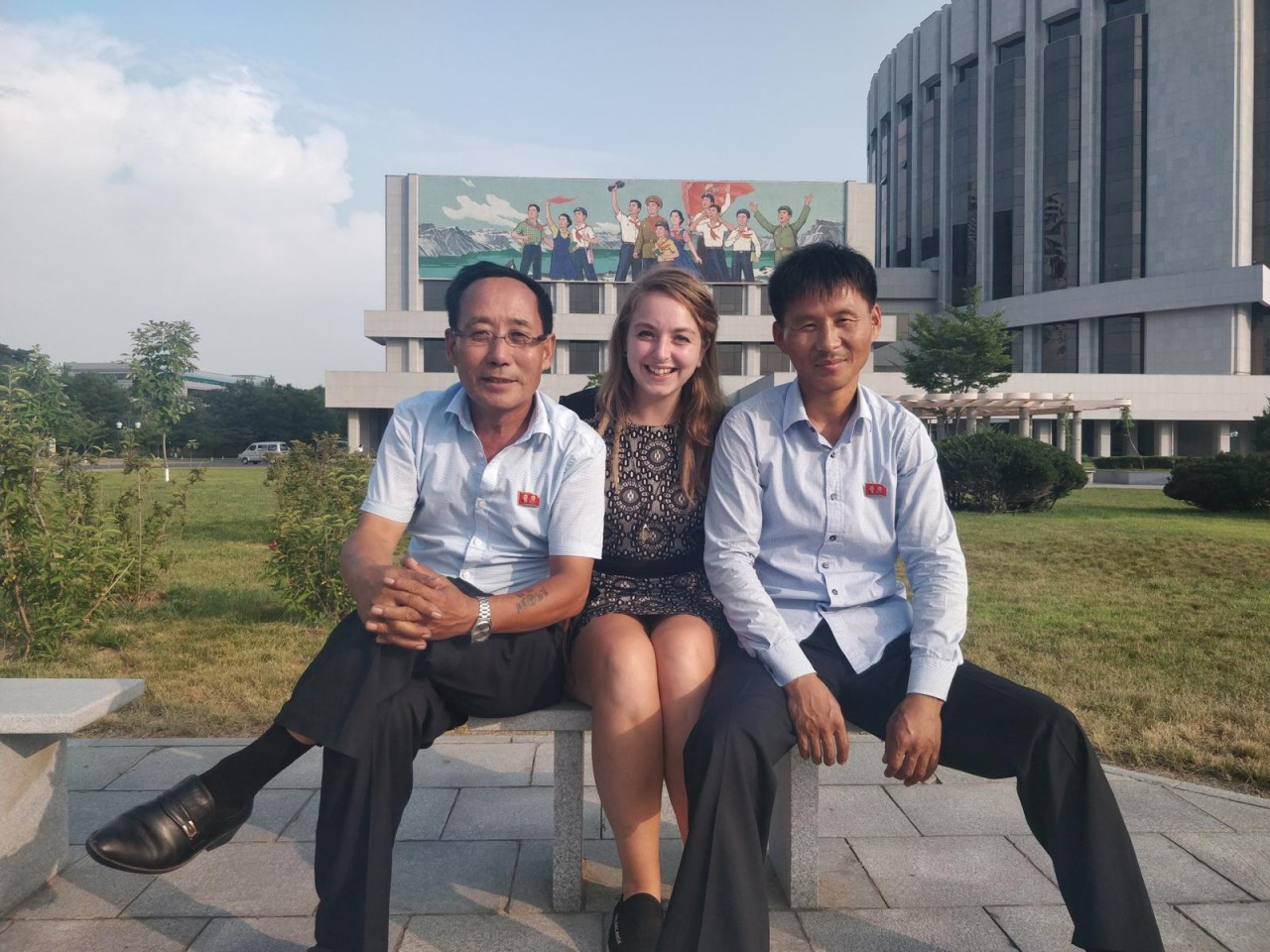 British traveler Zoe Stephens (centre) poses for a photograph with North Korean drivers outside the circus in Pyongyang in 2019. PHOTO: CONTRIBUTED/THE KOREA HERALD