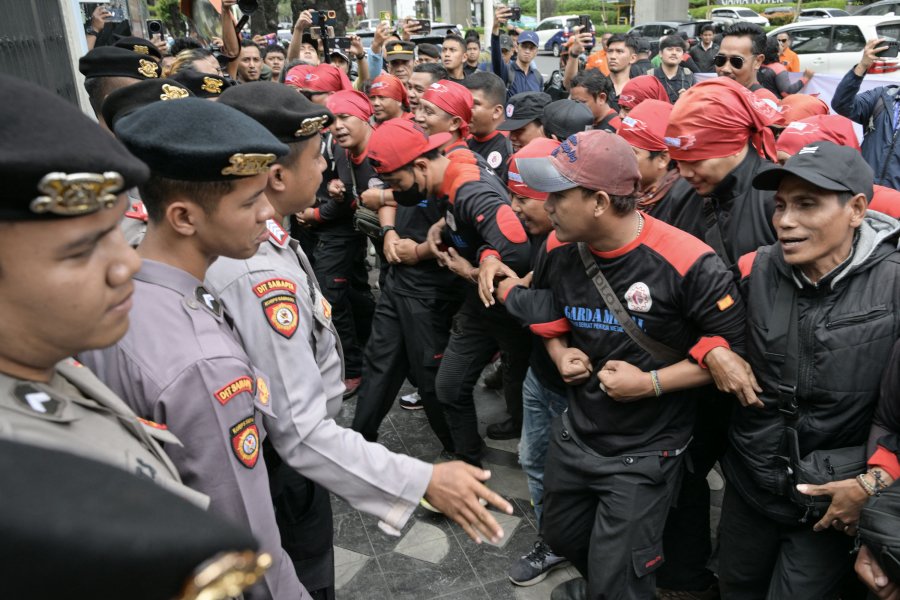 Malaysia starts probe into shooting that led to death of an Indonesian migrant worker