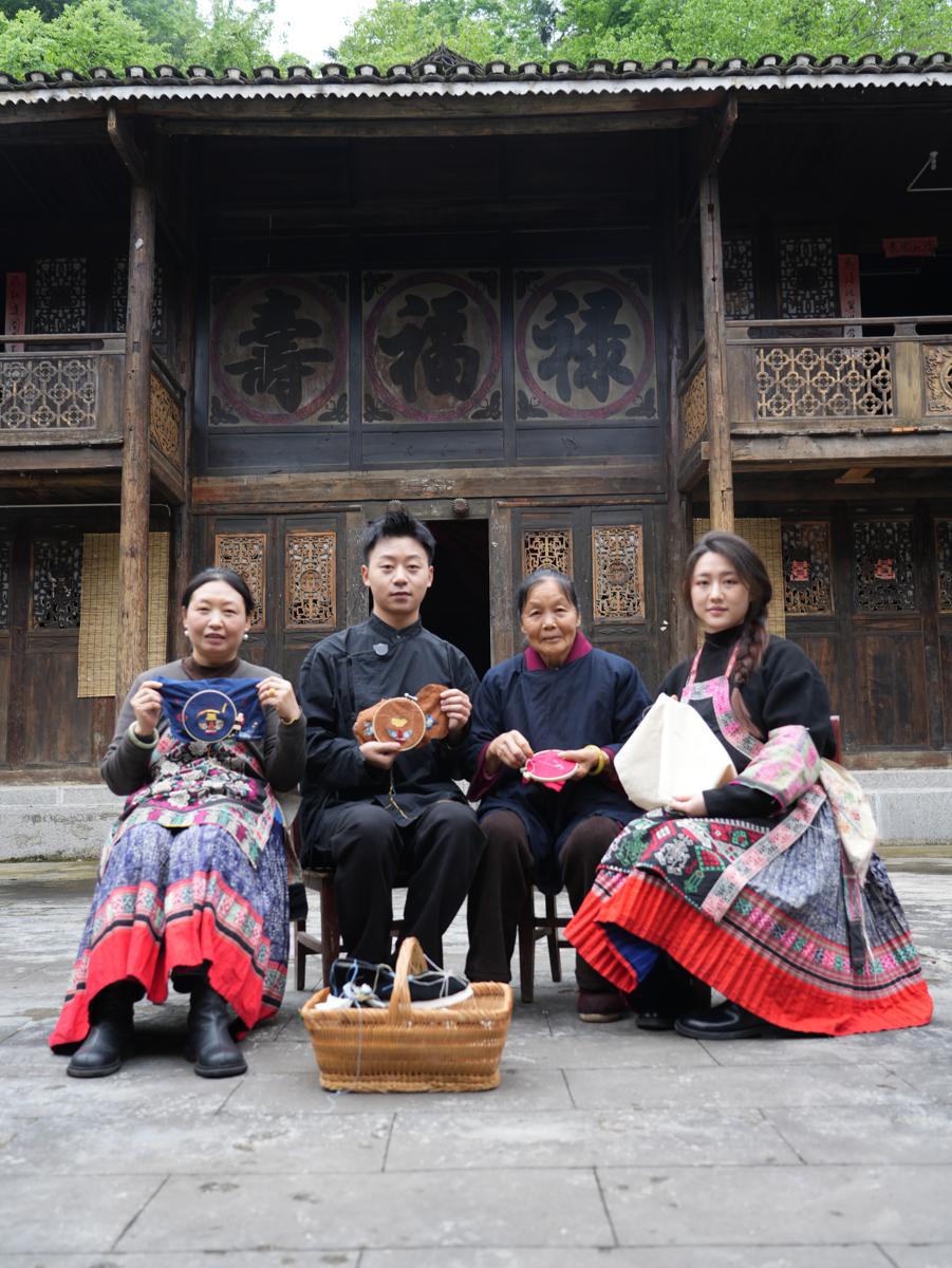 Young Chinese artisan transforms traditional Miao embroidery into modern fashion accessories