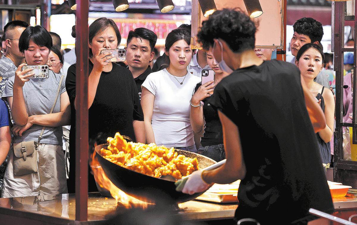 With 'smoke, fire and steam', China’s night markets erupt into life