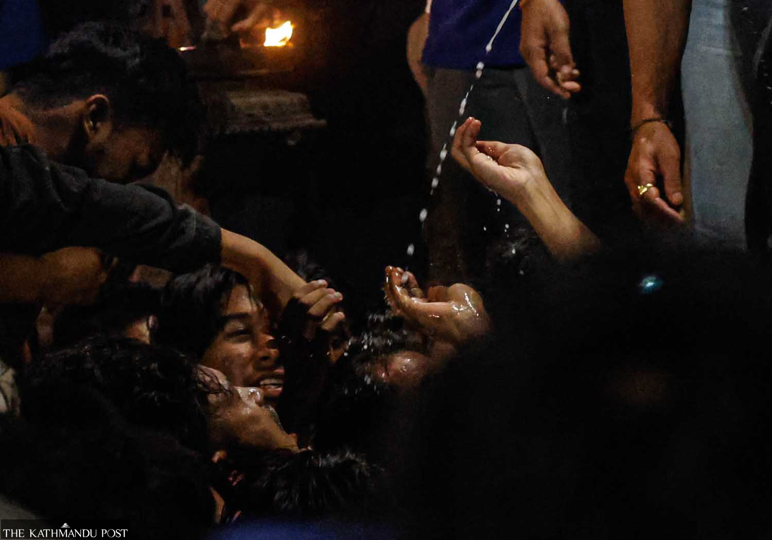 Devotees jostle to drink liquor during Nepal’s Indra Jatra celebrations