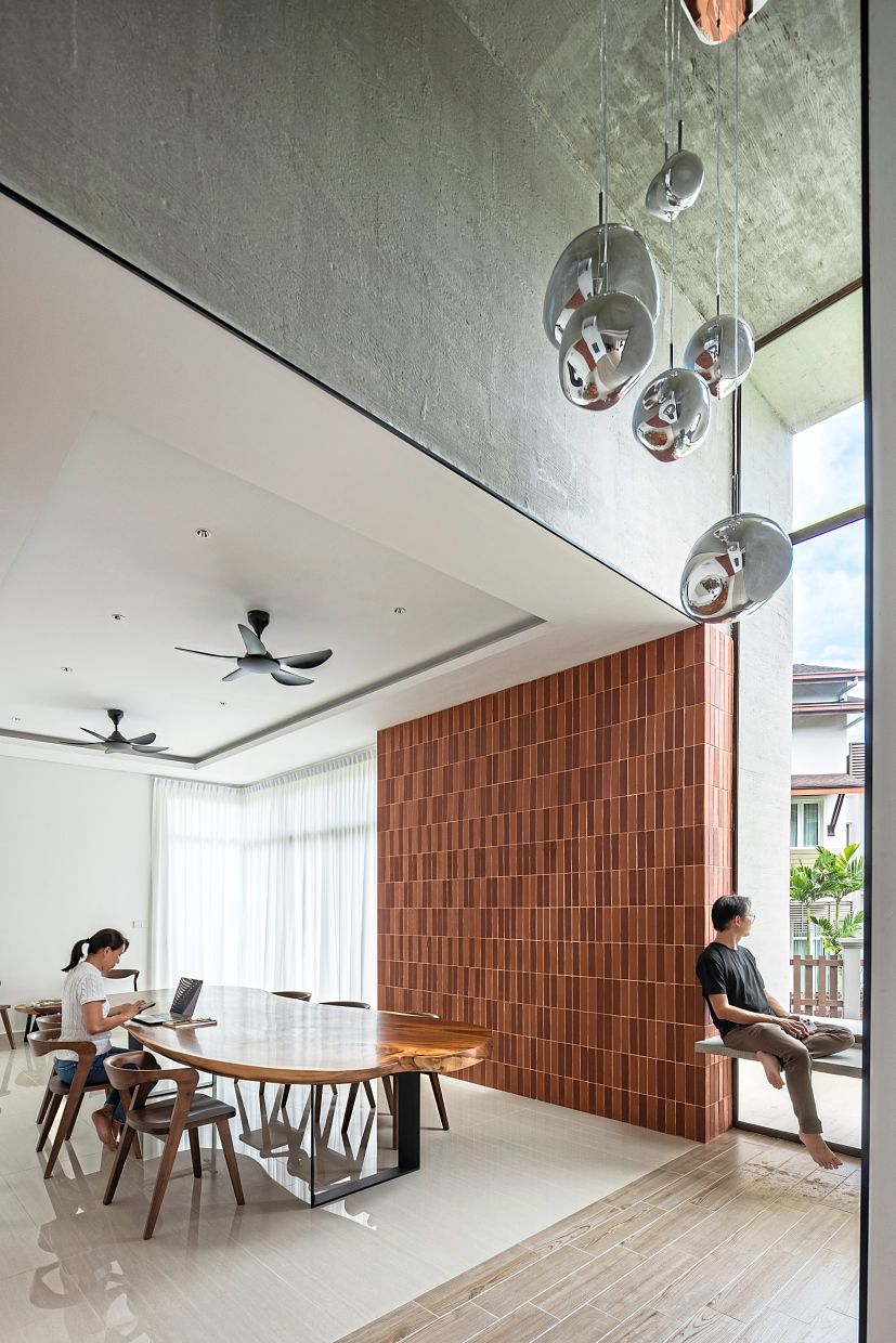 Malaysian architect turns 'ordinary house' into sculptural, liveable home