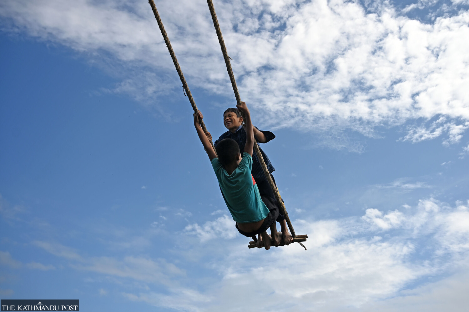 Festive spirit takes over Nepal: Children soar high on bamboo swings, travellers leave for hometowns