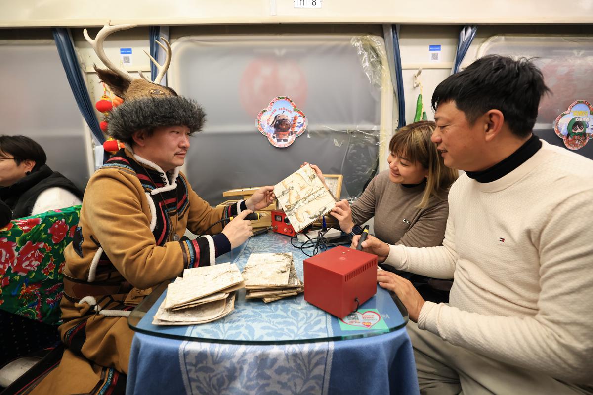 Folk-themed train takes international tourists to China's far north