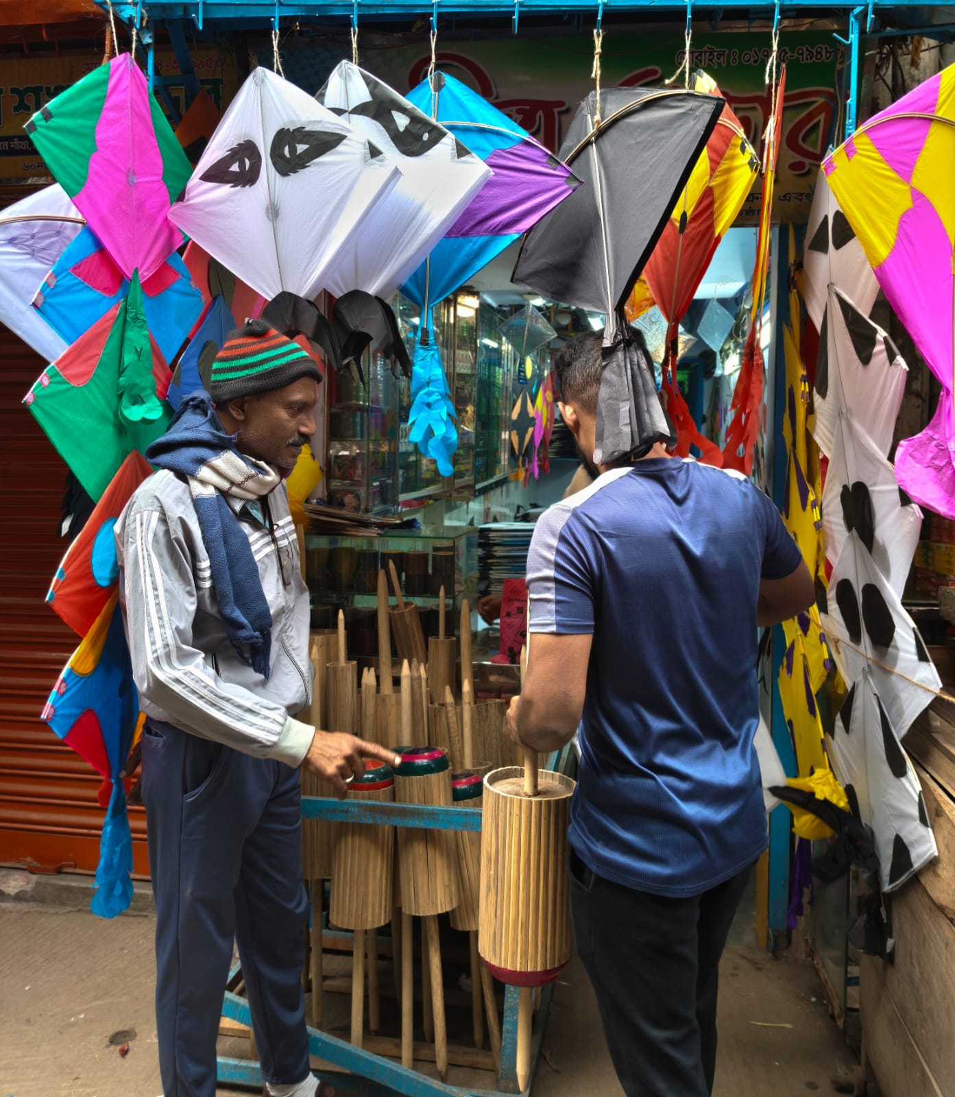 Just before Sakrain, a quiet exchange unfolds inside an old Dhaka kite shop, where buyers and sellers prepare for the sky’s annual celebration. PHOTO: THE DAILY STAR