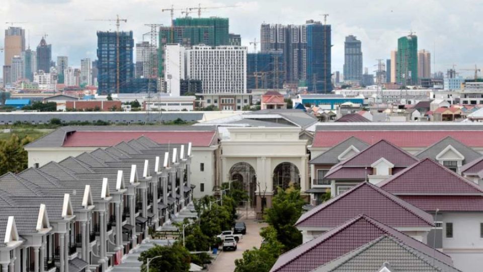 12_12_2023_a_view_of_the_phnom_penh_skyline_over_a_gated_community_known_locally_as_borey_in_meanchey_district_heng_chivoan.jpg