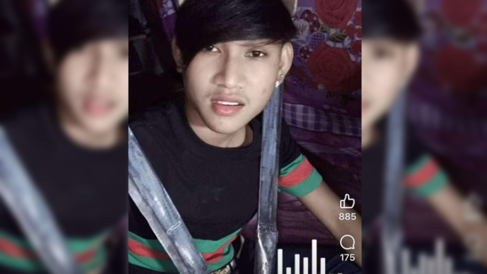 26_12_2024_a_still_from_a_video_release_to_social_media_of_a_young_man_posing_with_two_machete_kampot_police.png