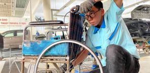 Teachers, students at vocational college help disabled by repairing wheelchairs