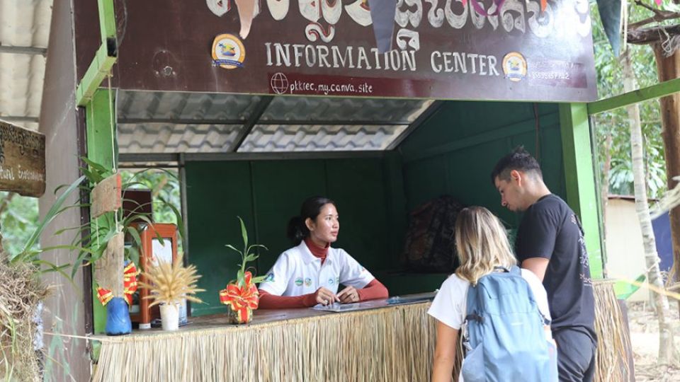9_1_2025_staff_welcome_visitors_at_the_information_centre_located_at_the_entrance_to_their_community_hong_raksmey.jpg