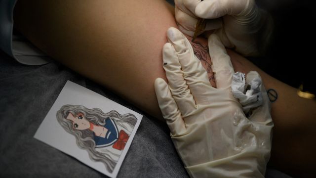 AFP__20200909__1X32GA__v1__MidRes__SkoreaSocialLawTattoo.jpg