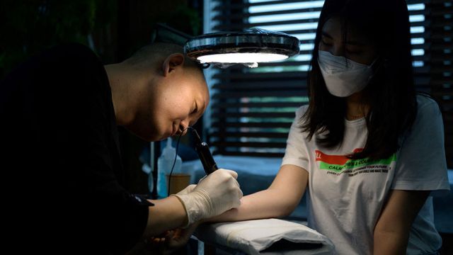 AFP__20200909__1X32GC__v1__MidRes__SkoreaSocialLawTattoo.jpg