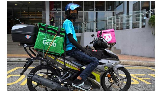 AFP__20201216__8W72GU__v1__MidRes__MalaysiaYear2020LabourEconomy.jpg