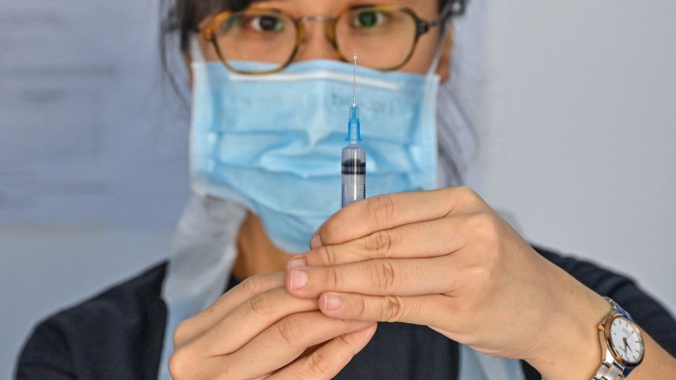 AFP__20210621__9CP94A__v1__MidRes__MalaysiaHealthVirus.jpg