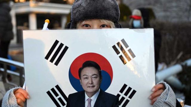 AFP__20260113__92GM4KE__v2__MidRes__SkoreaPoliticsTrialCoup.jpg