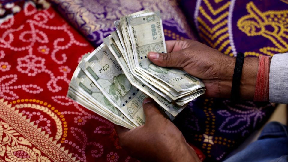 AFP__20260516__B323689__v1__MidRes__IndiaUsEconomyCurrency.jpg