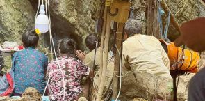 Local and international rescue teams pump water from Lao cave, hoping to reach last trapped men