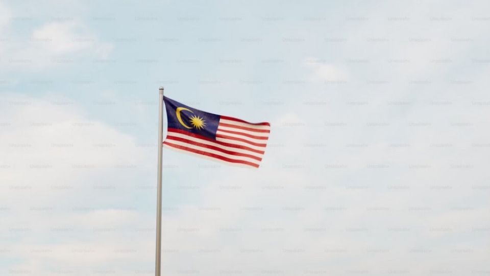 a-malaysian-flag-flying-high-in-the-sky.jpg