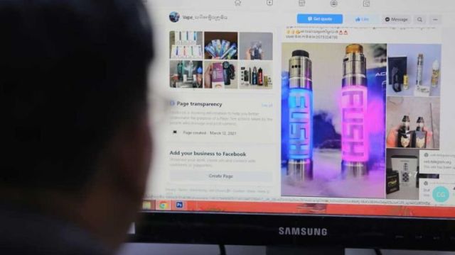 a_man_views_e-cigarette_advertisements_on_social_media._hong_menea.jpg