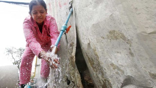 a_woman_washes_her_hands_with_tap_water_provided_by_state-owned_utility_phnom_penh_water_supply_authority_in_the_capitals_daun_penh_district_on_tuesday._heng_chivoan.jpg