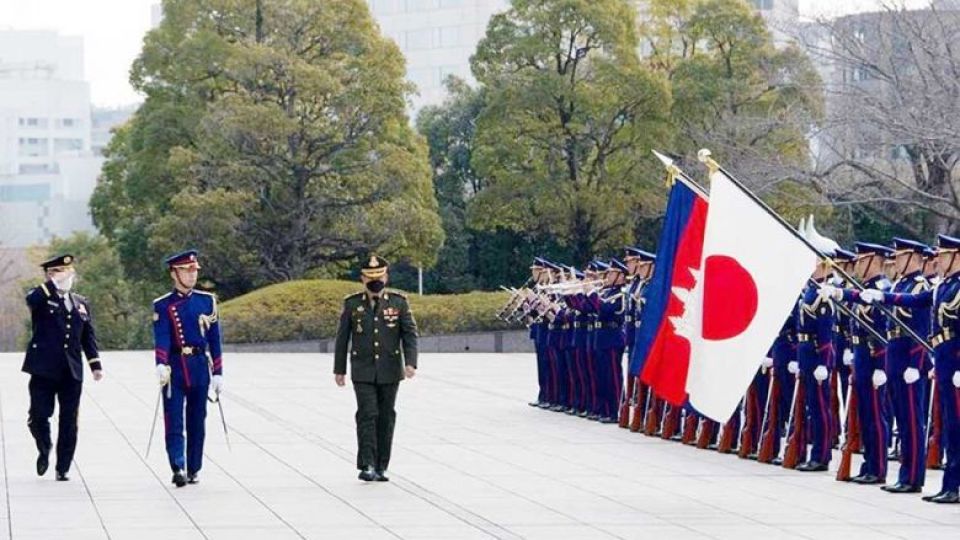 cambodian_army_chief_lieutenant_general_hun_walks_past_an_honour_guard_in_tokyo_on_tuesday._hun_manet_via_facebook.jpg