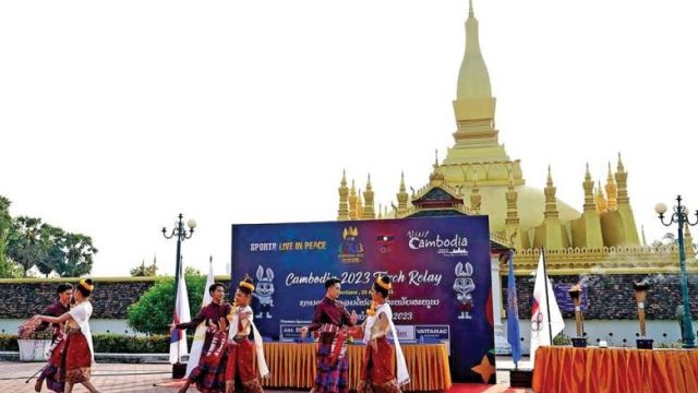 dance_performance_in_front_of_famous_phra_that_luang_monument_in_lao_capital_of_vientiane_on_april_25_to_welcome_the_torch_relay_procession._akp.jpg