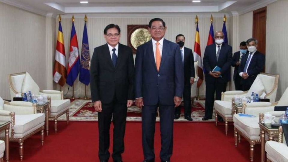 interior_minister_sar_kheng_right_meets_with_new_lao_ambassador_buakeo_phumvongsay_on_wednesday._sar_kheng_via_facebook.jpg