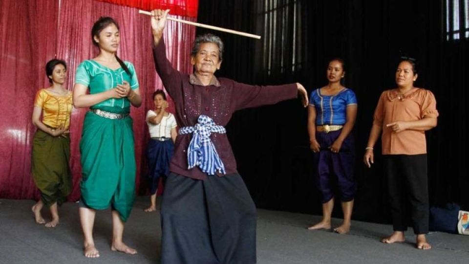 kin_yin_86_one_of_three_master_teachers_shows_her_students_a_traditional_dance_near_kien_svay_krao_pagoda_in_kandal_provinces_kien_svay_district_on_january_25._heng_chivoan.jpg