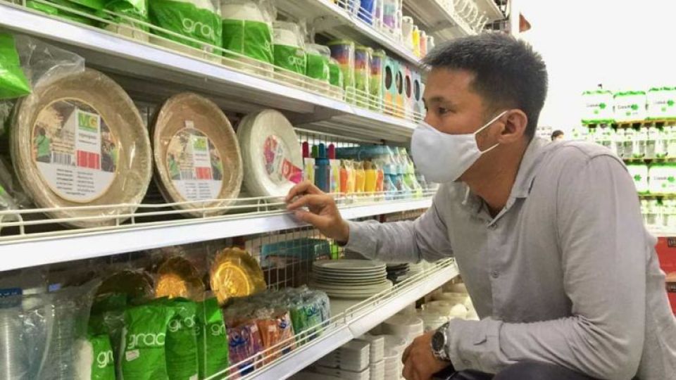 ngorn_makara_admires_his_eco-friendly_plates_on_display_at_a_phnom_penh_supermarket._supplied.jpg