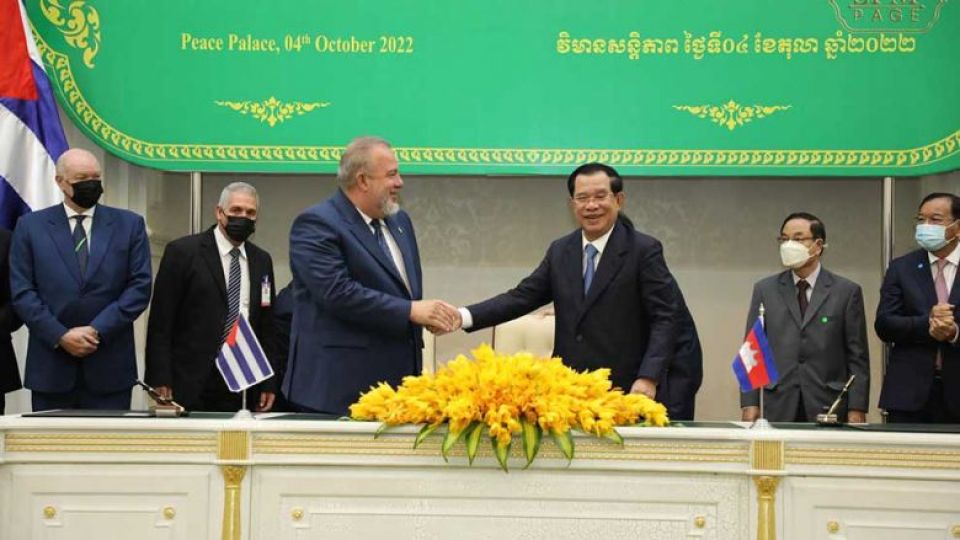 prime_minister_hun_sen_centre_right_shakes_hands_with_his_cuban_counterpart_manuel_marrero_cruz_at_the_peace_palace_in_phnom_penh_on_october_4._spm.jpg