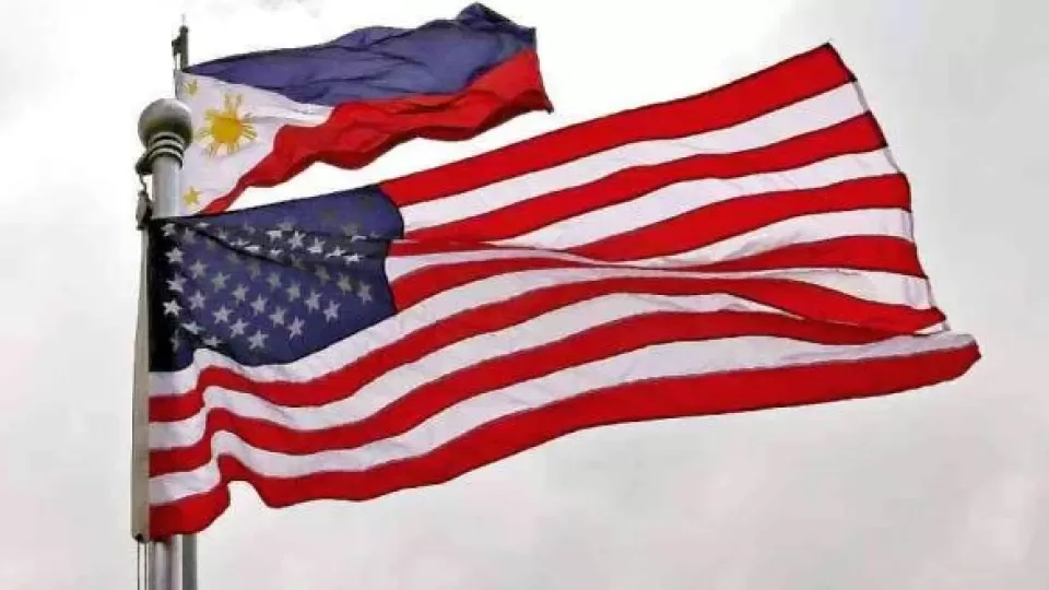 us-and-philippine-flags-flying-at-full-mast.webp
